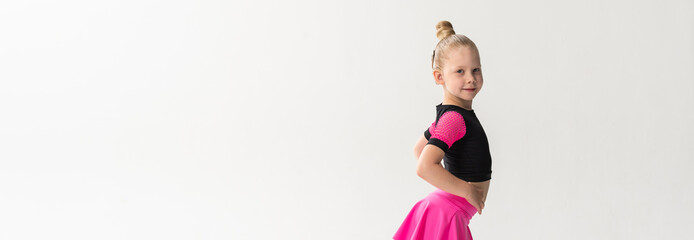 Portrait of child with cochlear implant during dance practice in studio. Banner with copy space. Hearing loss treatment, auditory rehabilitation, assistive medical device, emotional adaptation, and