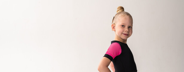 Portrait of child with cochlear implant during dance practice in studio. Banner with copy space. Hearing loss treatment, auditory rehabilitation, assistive medical device, emotional adaptation, and