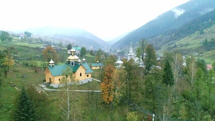 Orthodox church in mountain village with foggy