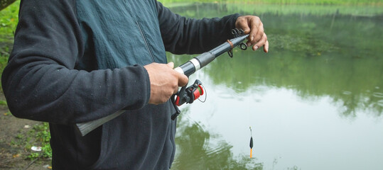 Fisherman catches fish. Fishing. Hobby