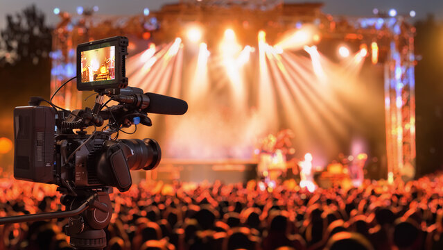 video camera filming concert stage 