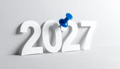 White 2027 Typography on Grey Background with Blue Push Pin Future Year Concept