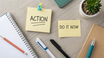 Overhead view of workspace with sticky notes promoting action