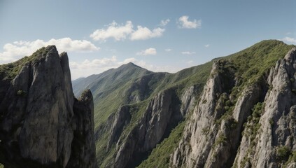Obraz premium Majestic mountain range with clear skies, rocky peaks, and lush green slopes