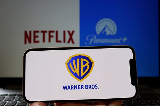 Netflix, Paramount and Warner Bros logos on screens. Media entertainment industry. 