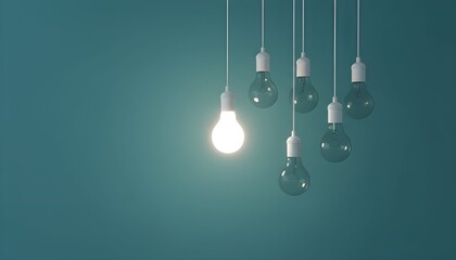 Hanging light bulbs with one glowing brightly in a row against a teal background from a straight viewpoint