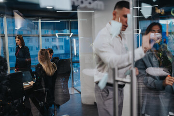 Obraz premium Professional team works in a glass-walled conference room with laptops and documents. Across the glass, colleagues pass by in a busy, contemporary office space.