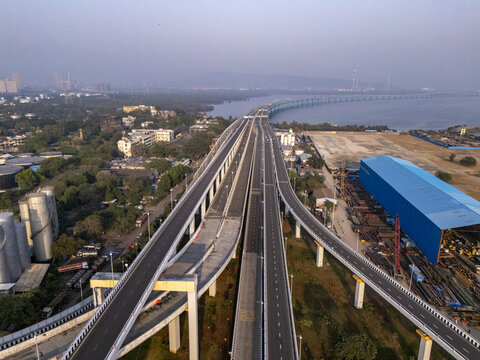 Aerial view of the expansive Shri Atal Bihari Vajpayee Trans Harbour Link stretching across the tranquil waters, a modern marvel of engineering, Mumbai, Maharashtra, India.