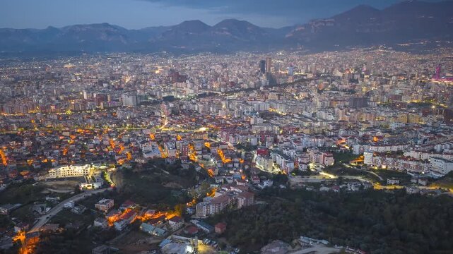 Aerial video showcasing Tirana&rsquo;s vibrant cityscape transforms from dusk to a glittering sea of lights beneath the Albanian mountains.