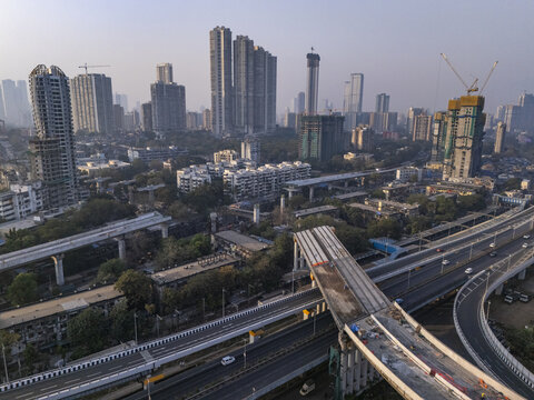Aerial view of the Shri Atal Bihari Vajpayee Trans Harbour Link cutting through the cityscape, a blend of urban development and transport infrastructure, Mumbai, Maharashtra, India.
