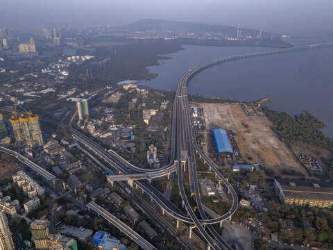 Aerial view of the Shri Atal Bihari Vajpayee Trans Harbour Link bridge stretching across the water, a steel artery connecting urban landscapes, Mumbai, Maharashtra, India.
