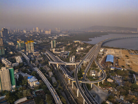 Aerial view of the Shri Atal Bihari Vajpayee Trans Harbour Link cutting through the city towards the coast, a modern vein amidst urban sprawl, Mumbai, Maharashtra, India.