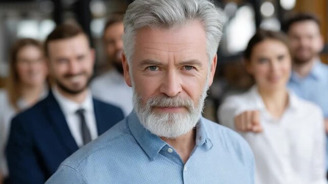 Confident Leadership: A distinguished leader, distinguished by his silver hair and resolute gaze, stands at the forefront of a supportive team. The image evokes experience and authority.