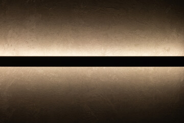 A warm-toned wall surface with a bold central black stripe