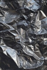 a crumpled aluminum foil texture, shiny and reflective.