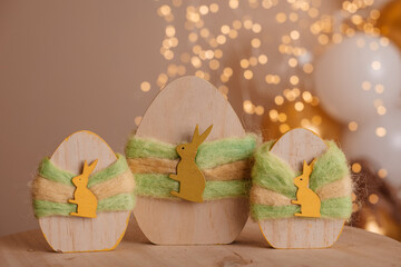 Wooden decorative eggs with bunny figures and wool