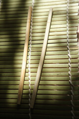 Obraz premium Close-Up of Chopsticks on Bamboo Surface