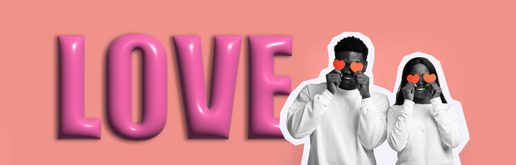 Two people pose in a set filled with bright colors and large lettering. They wear matching white outfits and hold up heart-shaped glasses, expressing joy and affection.