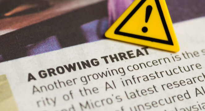 A Growing Threat Headline with Warning Symbol Emphasizing AI Security Concerns - Powered by Adobe