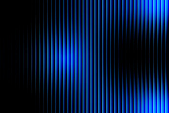 Blue light rays shining through dark vertical lines