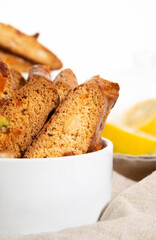 Italian cantucci cookies with nuts and candied fruits on a white background