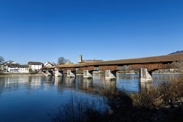 Bad Saeckingen across the Rhine with its old, historic wooden bridge and St. Fridolin's Minster in spring