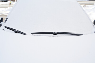 close up on car windshield covered with snow