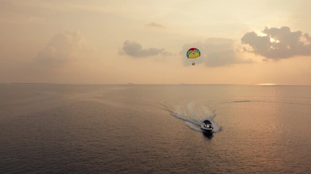 A serene sunset parasailing adventure over the open ocean