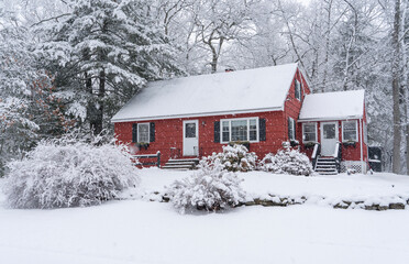 red winter house in snow
