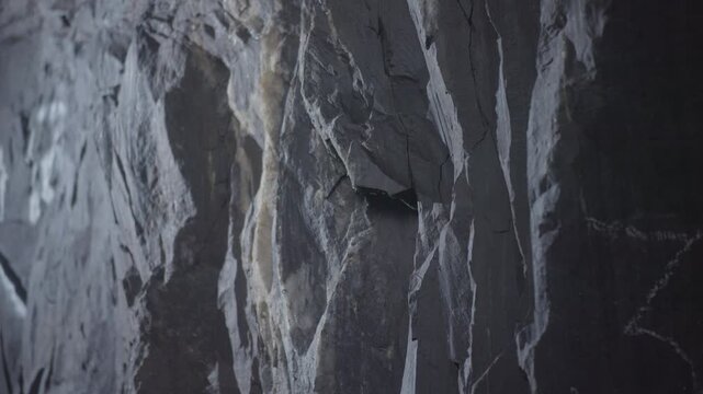 Mining Wall Details, Rusty Veins And Rugged Surface, Jagged Mineral Deposit Face With Blue Illumination
