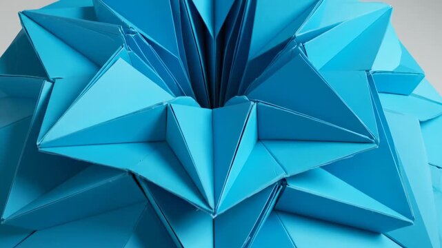 Blue Origami Sculpture: A striking close-up of a meticulously folded origami sculpture in a vibrant hue, highlighting the intricate geometric patterns and artistic precision.