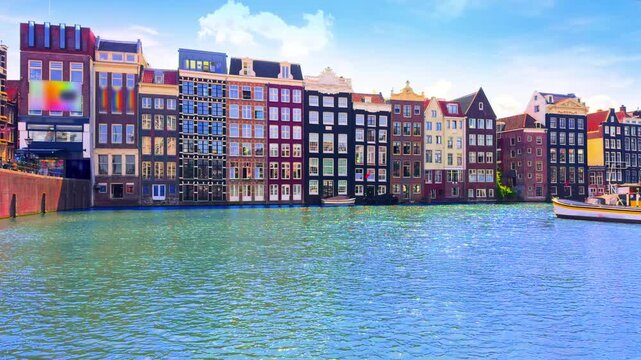 Colorful historic facades on Damrak canal in Amsterdam Netherlands