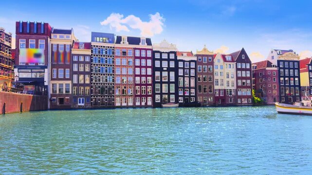 Colorful historic facades on Damrak canal in Amsterdam Netherlands