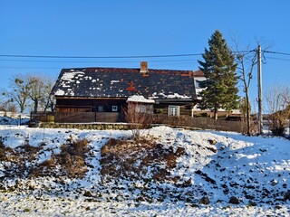 wooden village house in winter