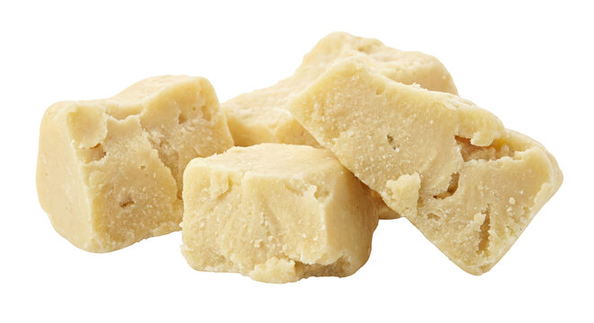 Chunks of raw unrefined organic shea butter isolated on transparent background