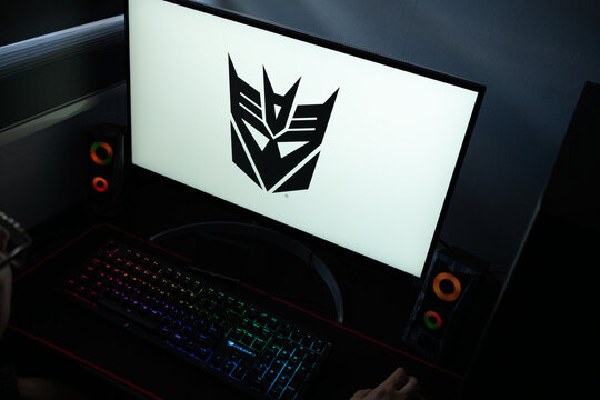 Punta Arenas, Chile &ndash; January 20, 2026: Transformers Decepticon faction logo displayed on a computer monitor in a dark room with RGB lighting