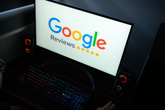 Punta Arenas, Chile &ndash; January 20, 2026: Google Reviews platform logo and star ratings displayed on a computer monitor in a dark room