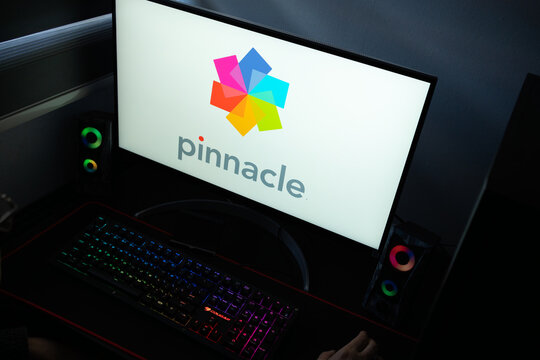 Punta Arenas, Chile &ndash; January 20, 2026: High-angle view of the Pinnacle video editing software wordmark on a PC screen with a backlit mechanical keyboard