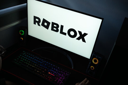 Punta Arenas, Chile &ndash; January 20, 2026: A desktop monitor featuring the stylized Roblox logo alongside glowing computer peripherals and RGB lighting