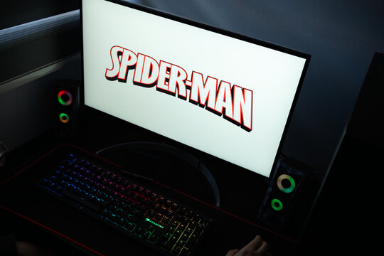 Punta Arenas, Chile &ndash; January 20, 2026: A desktop monitor featuring the stylized red and black Spider-Man logo alongside glowing computer peripherals