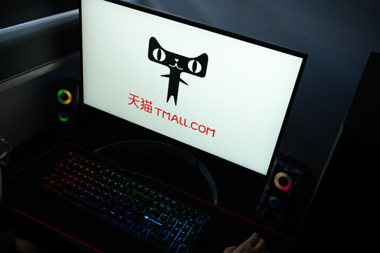Punta Arenas, Chile &ndash; January 20, 2026: A desktop monitor featuring the stylized Tmall logo alongside glowing computer peripherals and RGB lighting