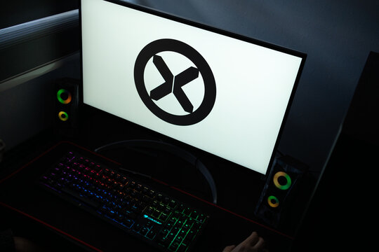 Punta Arenas, Chile &ndash; January 20, 2026: A desktop monitor featuring the stylized X-Men wordmark alongside glowing computer peripherals and RGB lighting