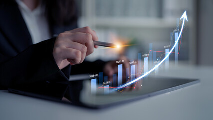 A businesswoman analyzes financial data showcased on a smartphone, highlighting growth trends and profit insights in a modern office environment. Scalp