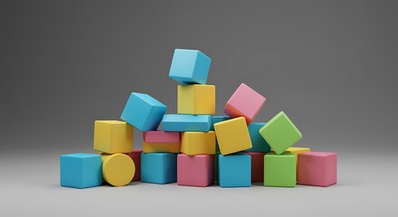 Obraz premium A pile of colorful building blocks on a gray surface