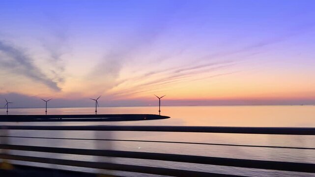 Great Belt Bridge sunset drive with wind turbines, Denmark
