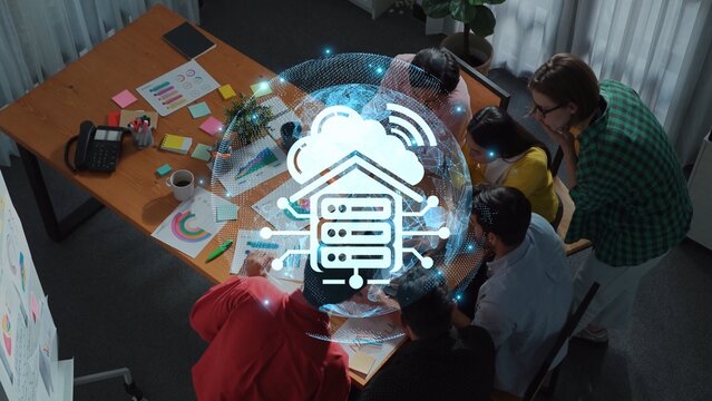 A diverse team engaged in a strategic meeting in a contemporary office, enhanced by a digital technology overlay representing data connectivity and innovation. Raster - Powered by Adobe