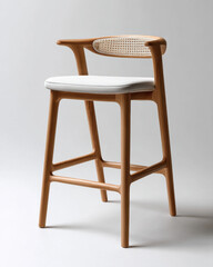 Fototapeta premium Modern tropical bar stool with wooden frame, woven backrest, white cushion, minimalist design, natural finish, comfortable seating