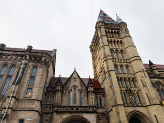 Naklejka premium University of Manchester grand Gothic campus building with tower in Manchester UK