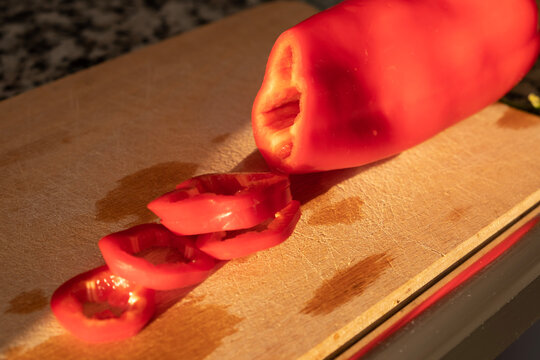  Chopped Red Capia Pepper on Wooden Board