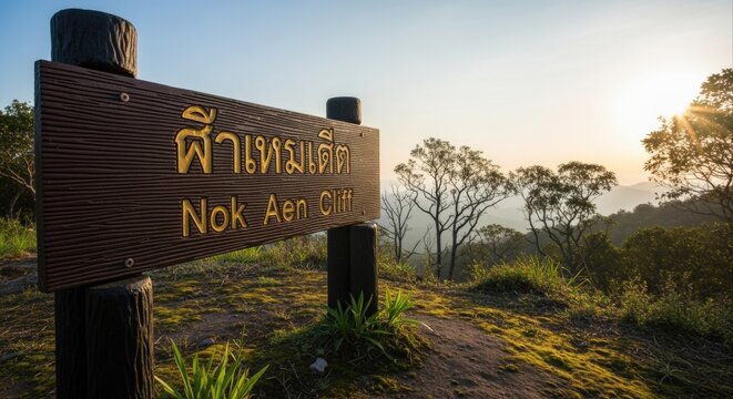 Scenic Mountain View with a Wooden Signpost at Nok Aen Cliff, Thailand